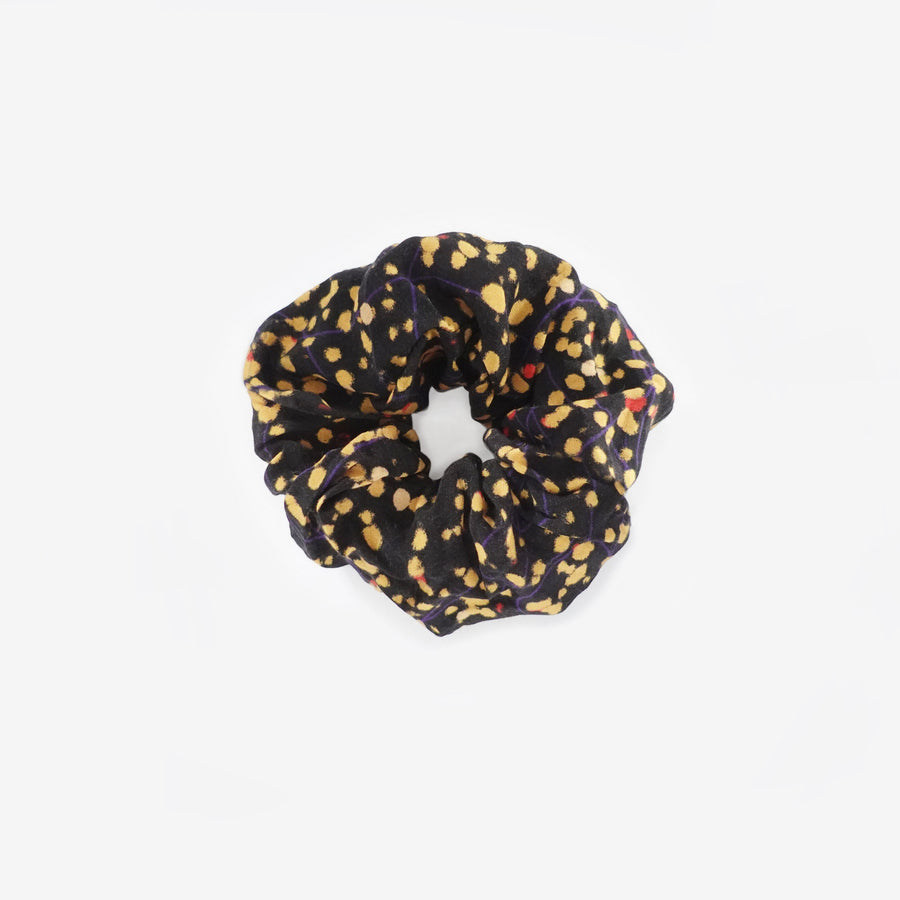 Black and yellow splatter print hair scrunchie shoot flat on white ground